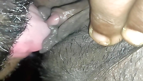 Indian girl fingers her boyfriend's face in the bedroom