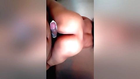 Big-assed indian girl giving a blowjob in the living room