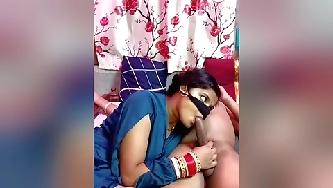 Indian teen sucks a man's hard dick in the kitchen