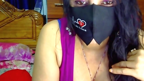 Busty indian babe shows off her body in the bedroom
