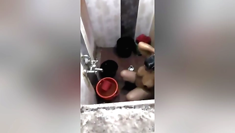Indian milf washes her pussy and gets dirty by a hidden cam