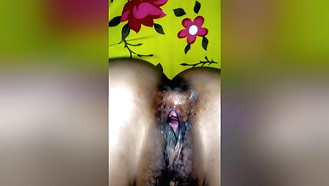 Indian hairy amateur girl gives a handjob to hairy pussy