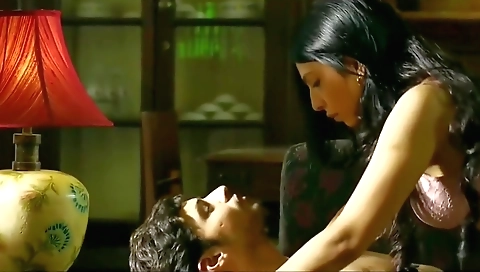 Indian big boobed woman plays with her cock in a gym