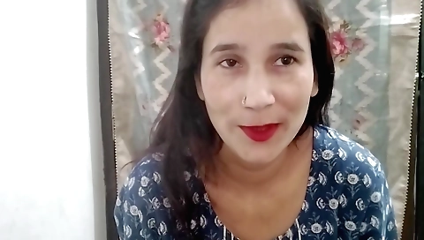 Indian paintgirl paints her body with a big paintbrush
