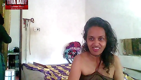 Indian teen is standing behind August in this video