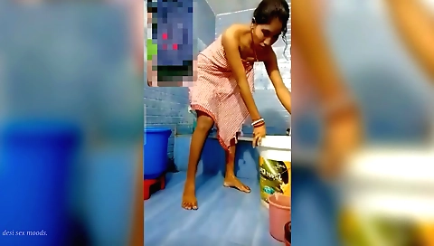 Indian brunette is naked in the shower and masturbates