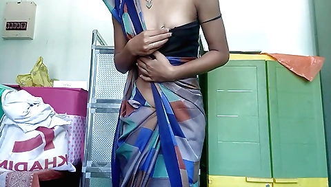 Solo female in black saree is wearing a small white dress