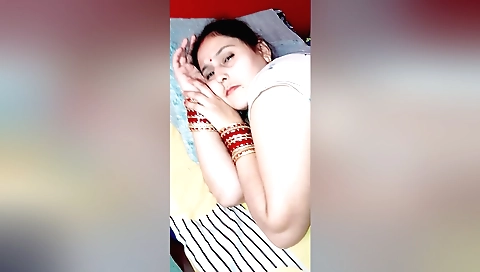 Indian brunette naked in her bedroom and masturbating