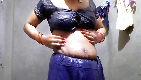 Indian woman in a pink bikini gets a handjob by the sink