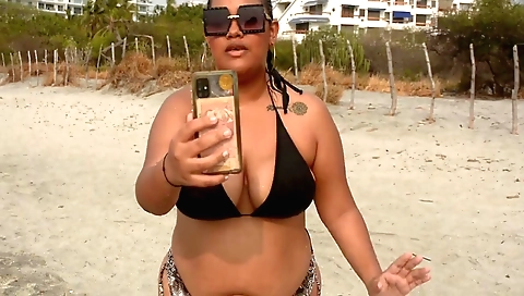 Busty Indian slut gets a brunette chick on the beach