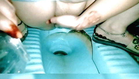 Indian blonde with big natural boobs has a great time in the toilet