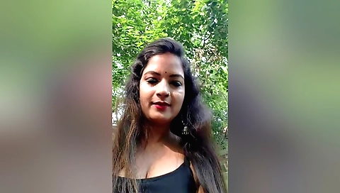 Solo female in indian outfit enjoys cooking dinner