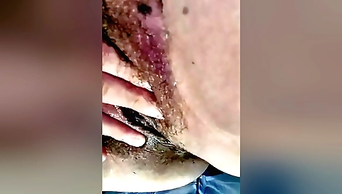 Indian solo female masturbates and rides hairy pussy