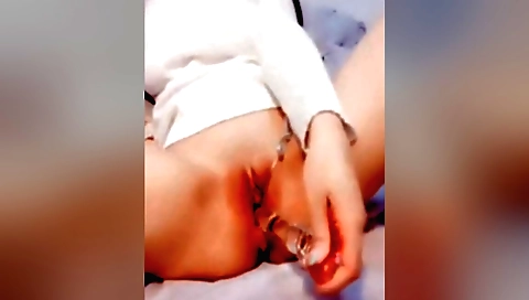 Solo amateur blonde girl masturbates on the bed and masturbates