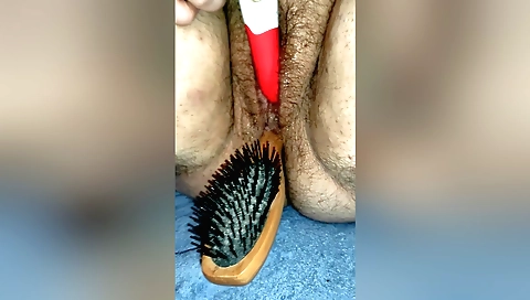 Hairy Indian slut moans as hairbrush gets stuck inside