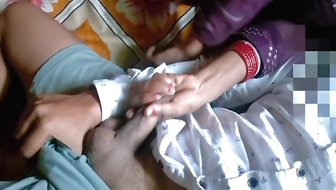 Indian girl with a beautiful face is getting a handjob