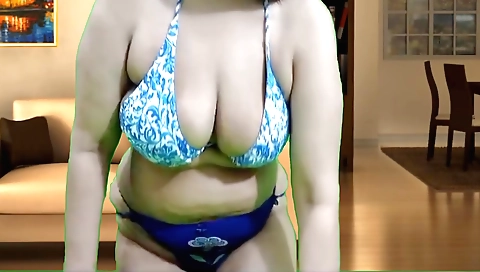 Indian brunette in a sexy outfit showing off her sexy body