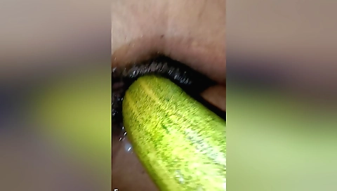 Hairy chick with a hairy pussy plays with a cucumber